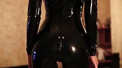 A latex girl ( black latex…thigh high pac boots)