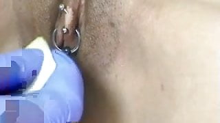 Horizontal clit hood piercing
