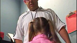 Barely legal slut sucks on three hard cocks at the same time